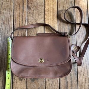 Brown crossbody bag with leather interior & zippered pockets